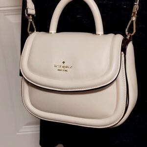 Kate Spade leather purse.  7.5 inches across,  5 inches tall.  New without tags.